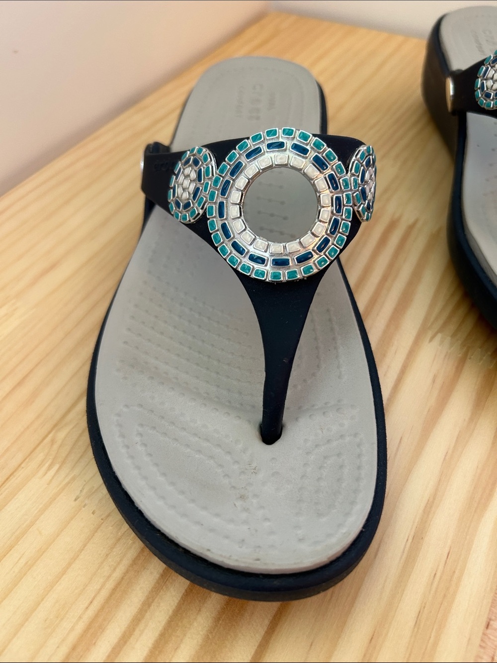 Crocs sandal in navy blue with blue, teal, and white detailing. - Picture 2 of 5